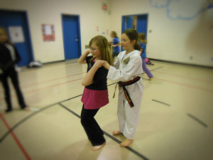 Here a Girl Guide learns the "pinky grab" to break free.