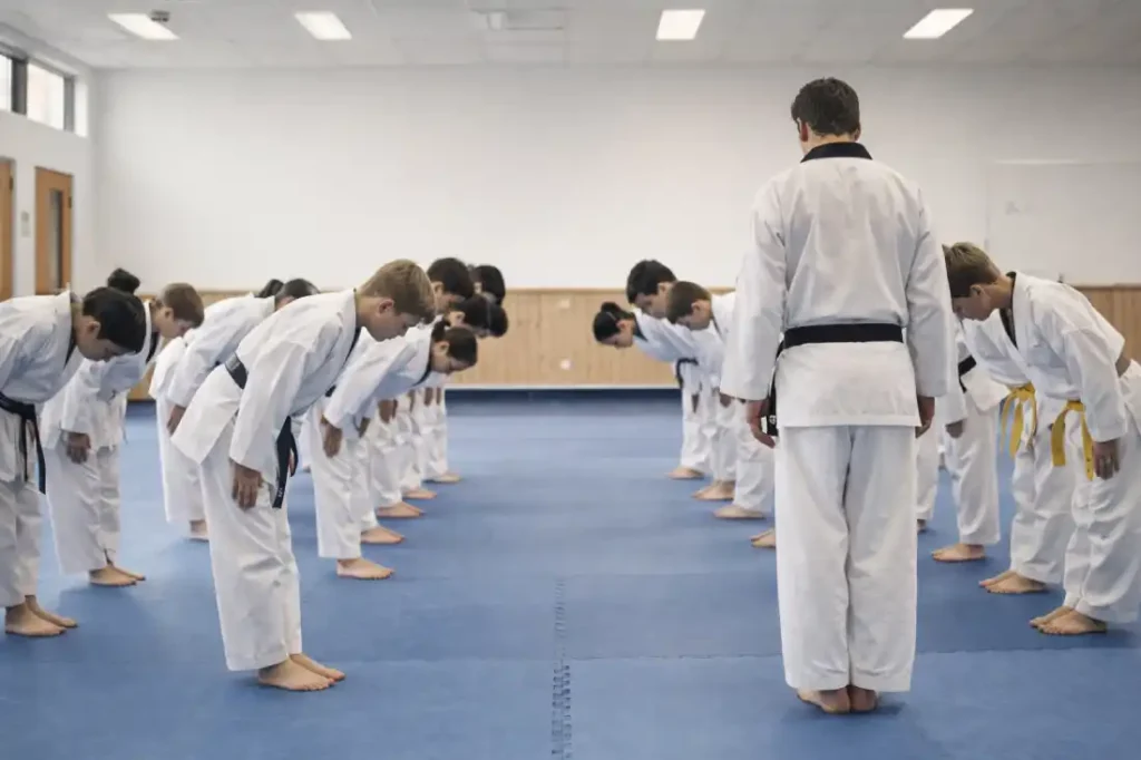 martial arts for bullying prevention students bowing in taekwondo class showing respect and discipline